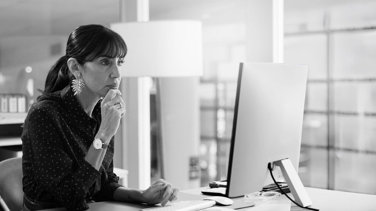Bank executive reading the Bedel Security blog on her desktop.